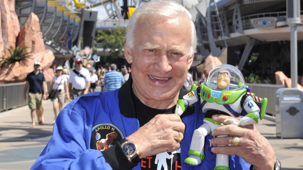 Astronaut Buzz Lightyear poses with a Buzz Lightyear toy in Disney World
