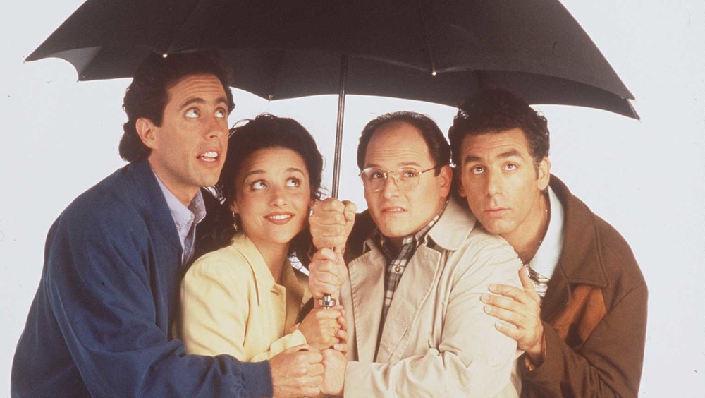 Seinfeld cast under umbrella